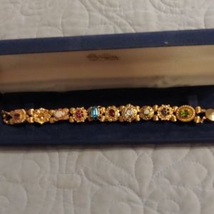 Beautiful 14 k gold slide bracelet with 10 slides.